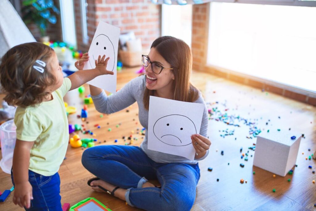 a therapist helps a young child with their aba therapy in their home